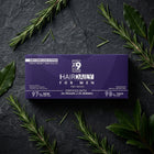 علبة Hair Daily للرجال على سطح حجر غامق مع أغصان روزماري